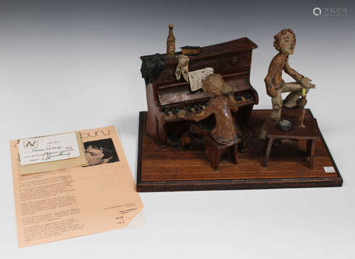 An Alan Lainchbury studio pottery stoneware 'Piano' figure group, dated 1972, modelled as a man