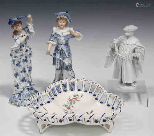 A pair of Continental porcelain figures, late 19th/early 20th century, decorated in blue and white