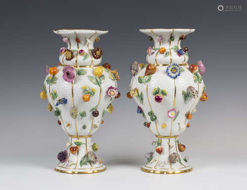 A large pair of Meissen porcelain fruit and flower encrusted vases, 19th century, the basketweave