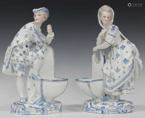 A pair of Continental porcelain Meissen style figures, late 19th century, white glazed with blue