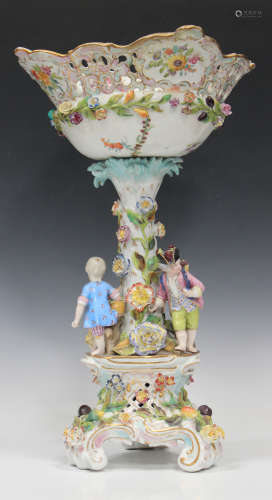 A Potschappel floral and fruit encrusted figural centrepiece, late 19th century, the pierced