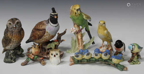 A mixed group of porcelain birds, 20th century, including a Goebel canary perched on a tree stump, a