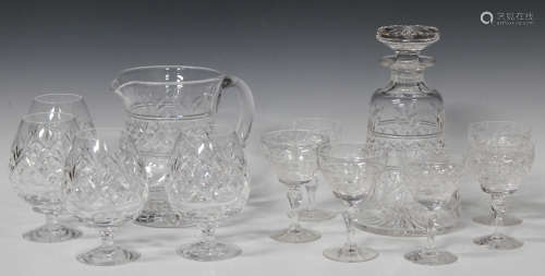 A mixed group of clear glass tableware, 20th century, including a Stuart cut glass jug with matching