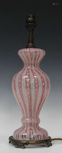 A Venetian glass lampbase, late 19th/early 20th century, the clear baluster body decorated with