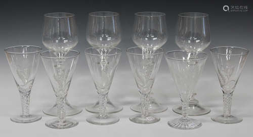 A set of five Stuart wine glasses, each conical bowl engraved with a thistle and raised on an