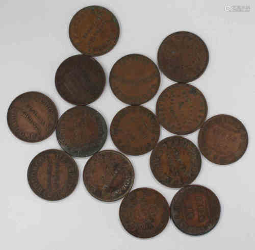 A group of fourteen 19th century Australian tokens, including three Stewart & Hemmant Drapers one