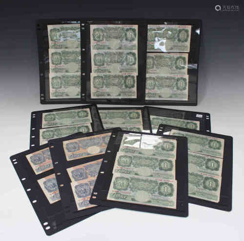 A collection of twenty-three green one pound notes K.O. Peppiatt Chief Cashier, together with five