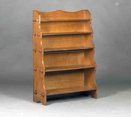 An Edwardian Arts and Crafts oak five-tier graduated waterfall bookcase, possibly by Wylie &