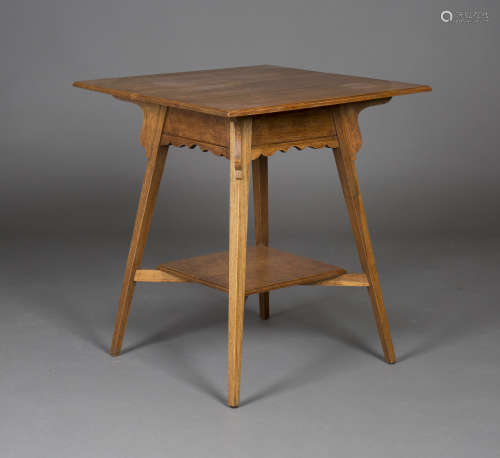 An Edwardian Arts and Crafts oak two-tier square occasional table, in the manner of Liberty & Co,