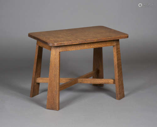 An Edwardian Arts and Crafts oak occasional table, probably Glasgow School, the rectangular top