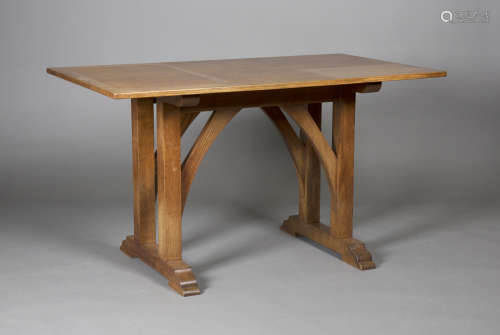 An early 20th century Arts and Crafts oak centre table, in the manner of Heals, the rectangular