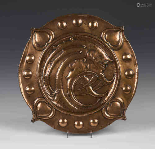 A late 19th/early 20th century Arts and Crafts copper charger, attributed to Norman and Ernest