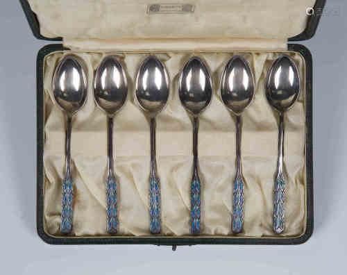 A set of six Liberty & Co silver and enamelled coffee spoons, each handle engraved and enamelled