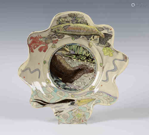 A Maureen Minchin studio pottery bowl, the interior decorated with an otter, the wavy edged rim with