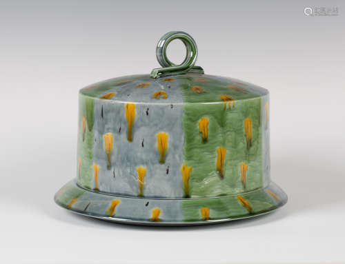 A Kevin de Choisy studio pottery cheese dome and stand, glazed with alternating green and pale