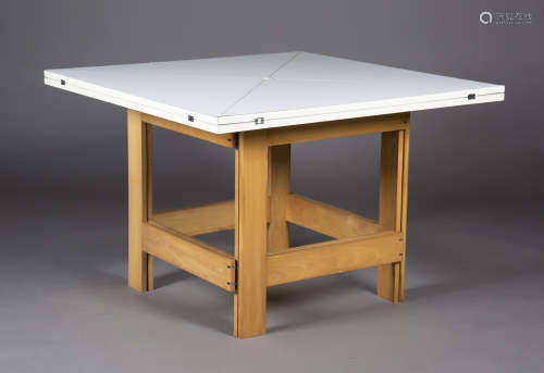 A late 20th century white melamine and beech folding envelope dining table, probably retailed by The