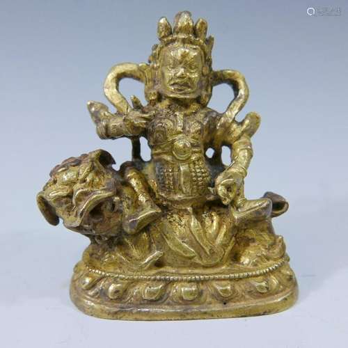 SMALL SINO TIBETAN GILT BRONZE BUDDHA RIDING LION-