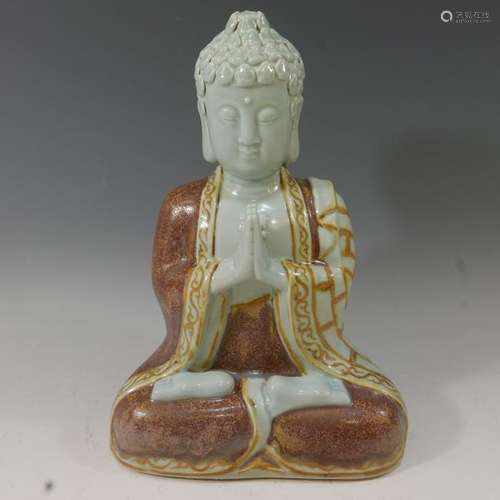 CHINESE CELADON AND RED GLAZE FIGURE OF BUDDHA