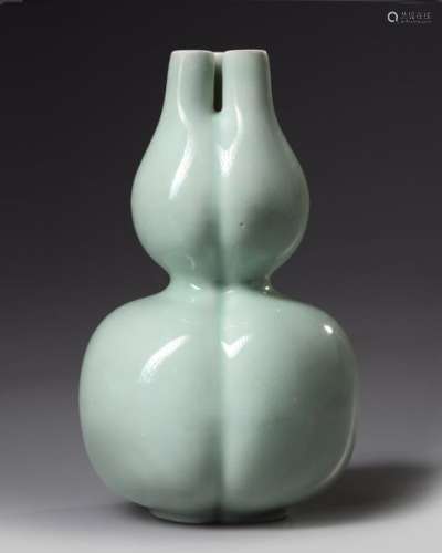A Chinese celadon glazed triple gourd vase