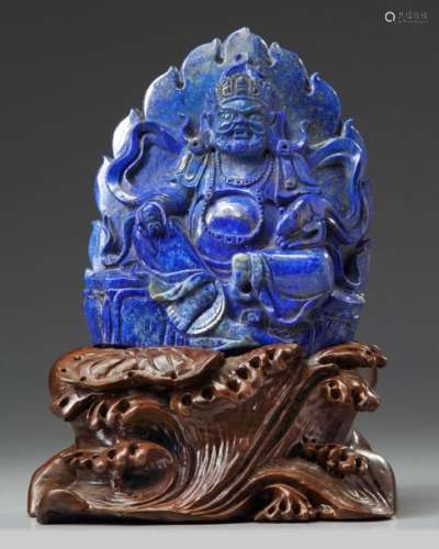 A Chinese lapis lazuli figure of Jambhala.