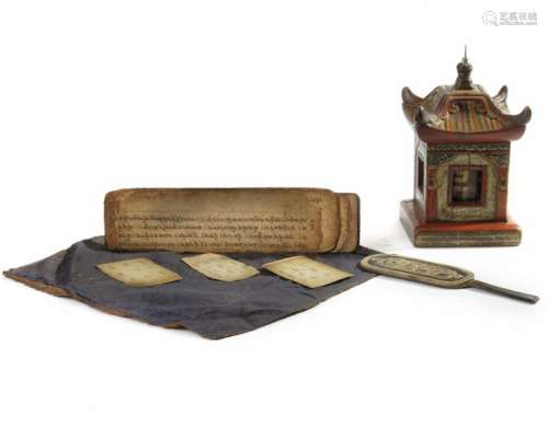 A small Mongolian leather bag, three manuscript se…