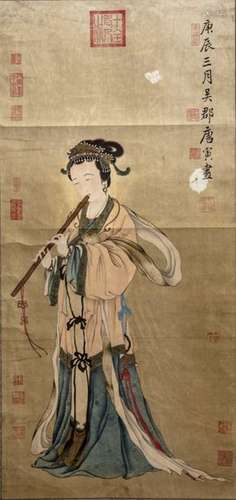 A Chinese hand scroll depicting a lady playing the…