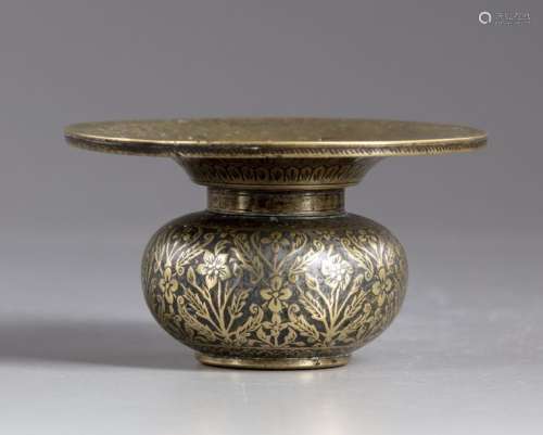 An Islamic brass pot