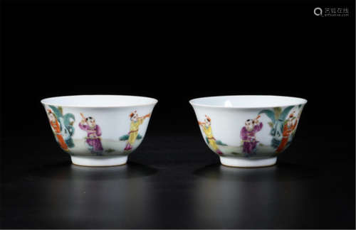 PAIR OF CHINESE PORCELAIN FAMILLE ROSE BOY PLAYING BOWLS