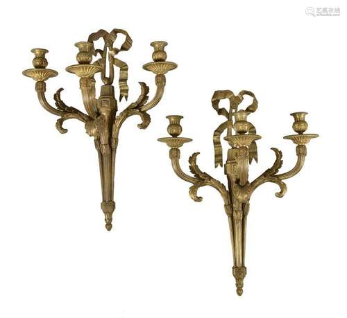 A pair of substantial gilt bronze three light wall…