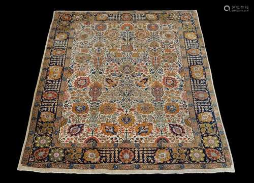 A Tabriz carpet, the cream field decorated with an…