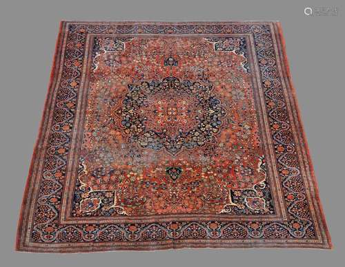 A Sarouk Feraghan carpet, the madder field decorat…