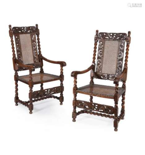 A pair of Charles II caved walnut armchairs, circa…