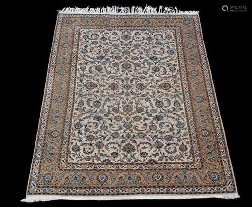 A Kashan carpet, the pale field decorated overall …