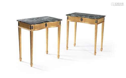 A pair of marble topped giltwood side tables, in G…