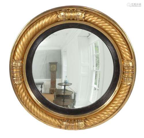 A George III giltwood convex mirror, circa 1810, b…