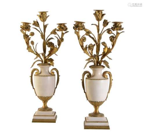 A pair of Continental white marble and gilt bronze…