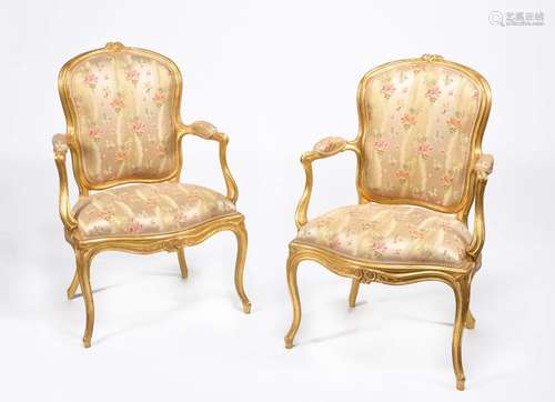 A pair of George III carved giltwood armchairs, ci…