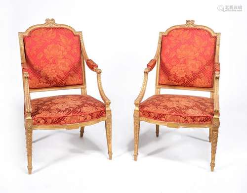 A pair of George III carved giltwood armchairs, ci…