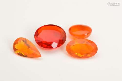 A COLLECTION OF FOUR FIRE OPALS, to include a mix cut oval measuring approximately 14.07mm x 12.