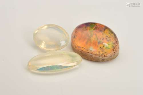 A SELECTION OF THREE WATER OPALS, oval cabochon with matrix base measuring approximately 15.00mm x