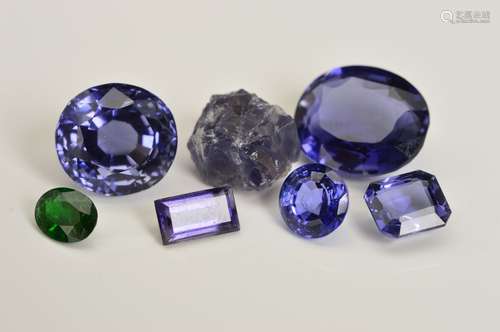 A MIXED SELECTION OF GEMSTONES CONTAINING FIVE IOLITE GEMSTONES OF VARIOUS SHAPES AND SIZES, oval,