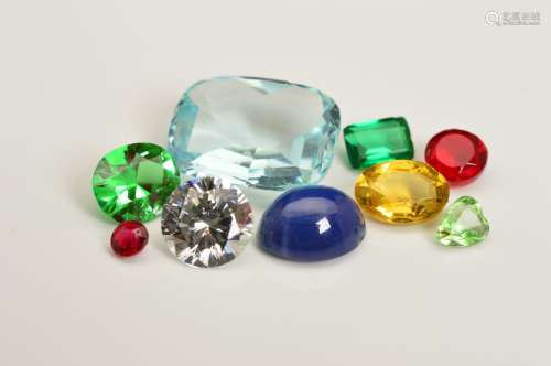 A LARGE COLLECTION OF SYNTHETIC, COMPOSITE AND PASTE STONES, to include sapphire, ruby, GTD's,
