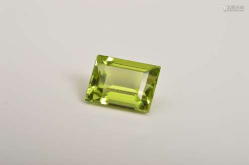 A RECTANGLE CUT PERIDOT, measuring approximately 8.1mm x 6.1mm, weighing 1.94ct