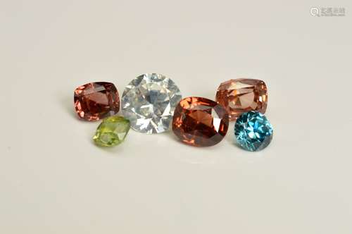 A SELECTION OF ZIRCON GEMSTONES, to include various shapes, sizes and colours, ranging between 0.