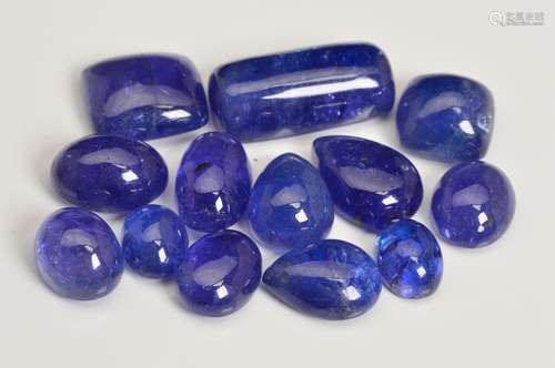 A SELECTION OF LARGE CABOCHON CUT TANZANITES, of various shapes, round, pear, oval, to include a