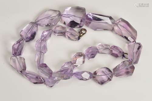 FACETED AMETHYST BEAD NECKLACE, comprising twenty five beads, graduating in size between 8mm - 30mm,