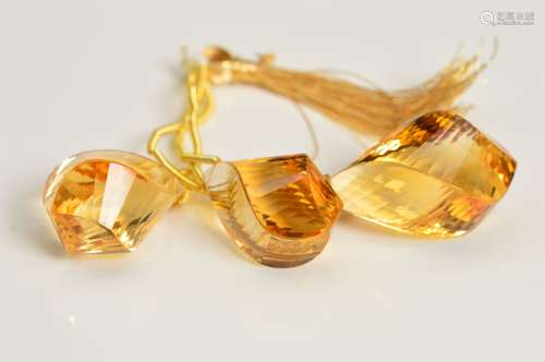 THREE CITRINE TWISTED BEADS, measuring approximately 17mm, approximate combined weight 52.45cts