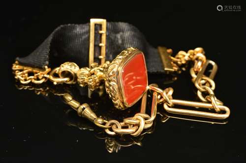 A VICTORIAN FANCY SINGLE ALBERT CHAIN, together with a black ribbon fob, suspending a gold-plated