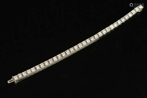 A MID TO LATE 20TH CENTURY DIAMOND LINE BRACELET, measuring approximately 180mm in length, each