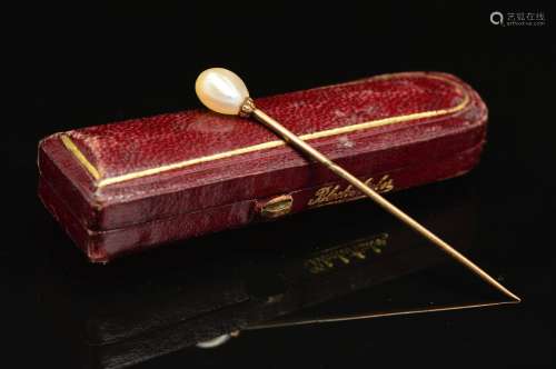 A VICTORIAN NATURAL PEARL STICK PIN, measuring approximately 63mm in length, accompanied with a